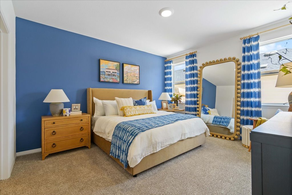 2513 Caleb Asher Loop Round Rock, TX 78665 - Photo 4 of 40 a spacious bedroom with a bed and a lamp