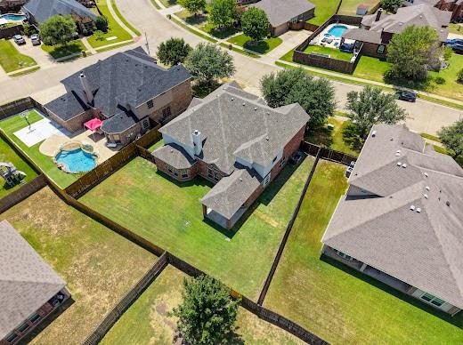 5034 West Fall Drive Midlothian, TX 76065 - Photo 39 of 40 Aerial perspective showcasing a residential property with a brick exterior and a grey shingle roof