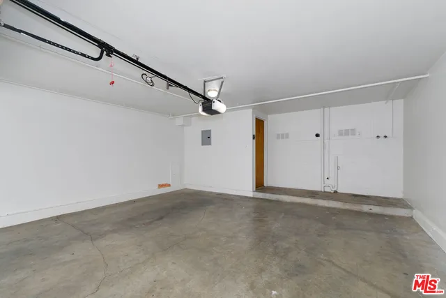 a view of a house with a parking area