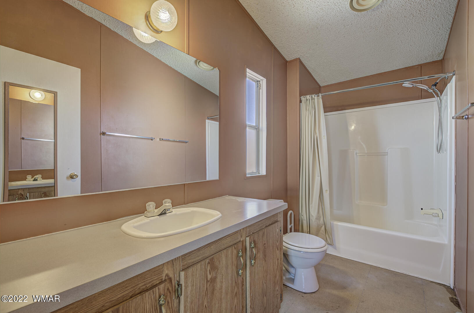 313 South Clark Road Payson, AZ 85541 - Photo 19 of 27 a bathroom with a granite countertop sink toilet a mirror and shower