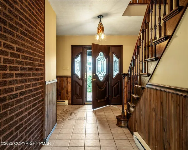 a view of a door and wooden floor