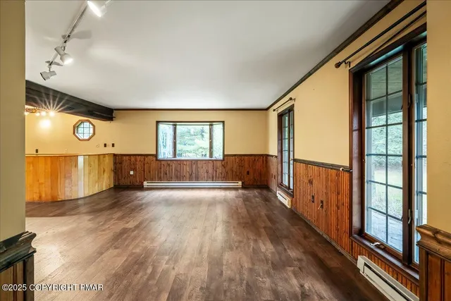 a view of a livingroom with a fireplace and window