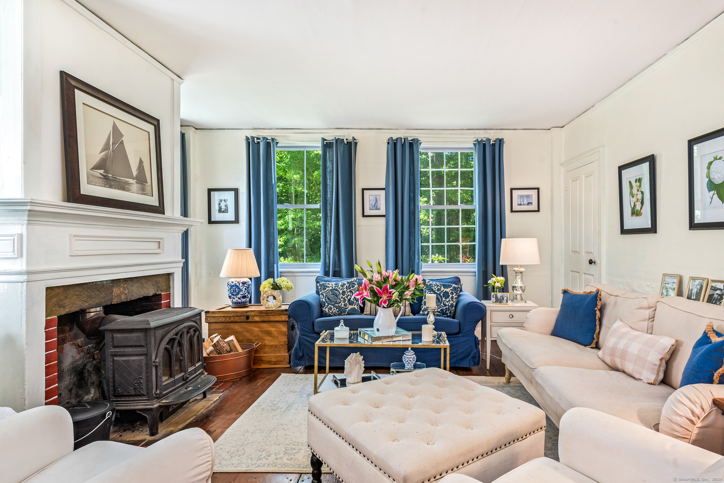 402 Perrin Road Woodstock, CT 06281 - Photo 17 of 40 a living room with furniture and a fireplace