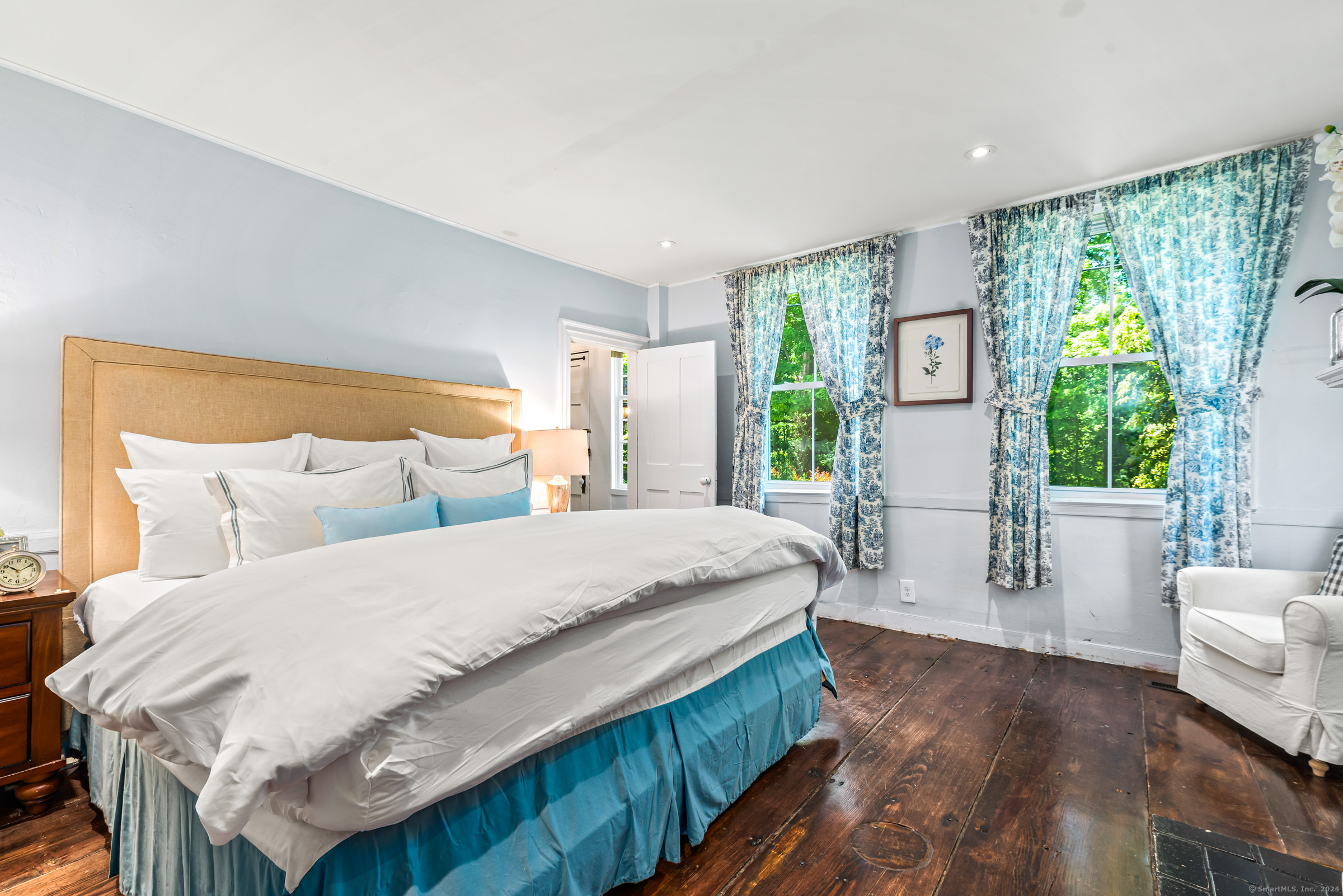 402 Perrin Road Woodstock, CT 06281 - Photo 20 of 40 a spacious bedroom with a bed and a large window