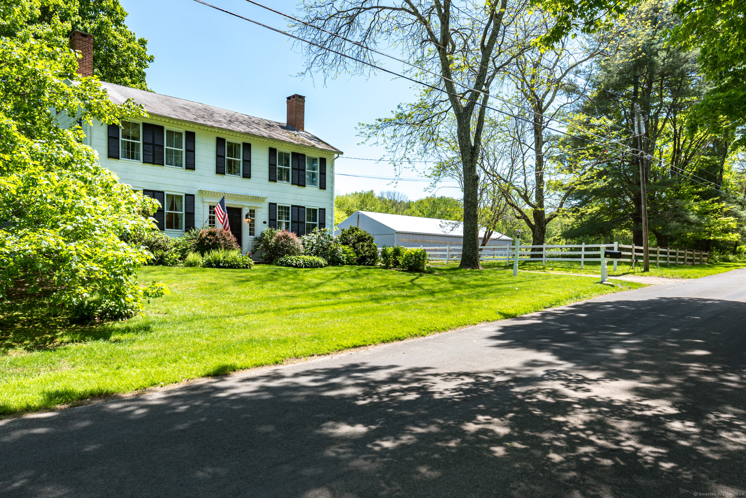 402 Perrin Road Woodstock, CT 06281 - Photo 2 of 40 a view of a house with a big yard and large trees
