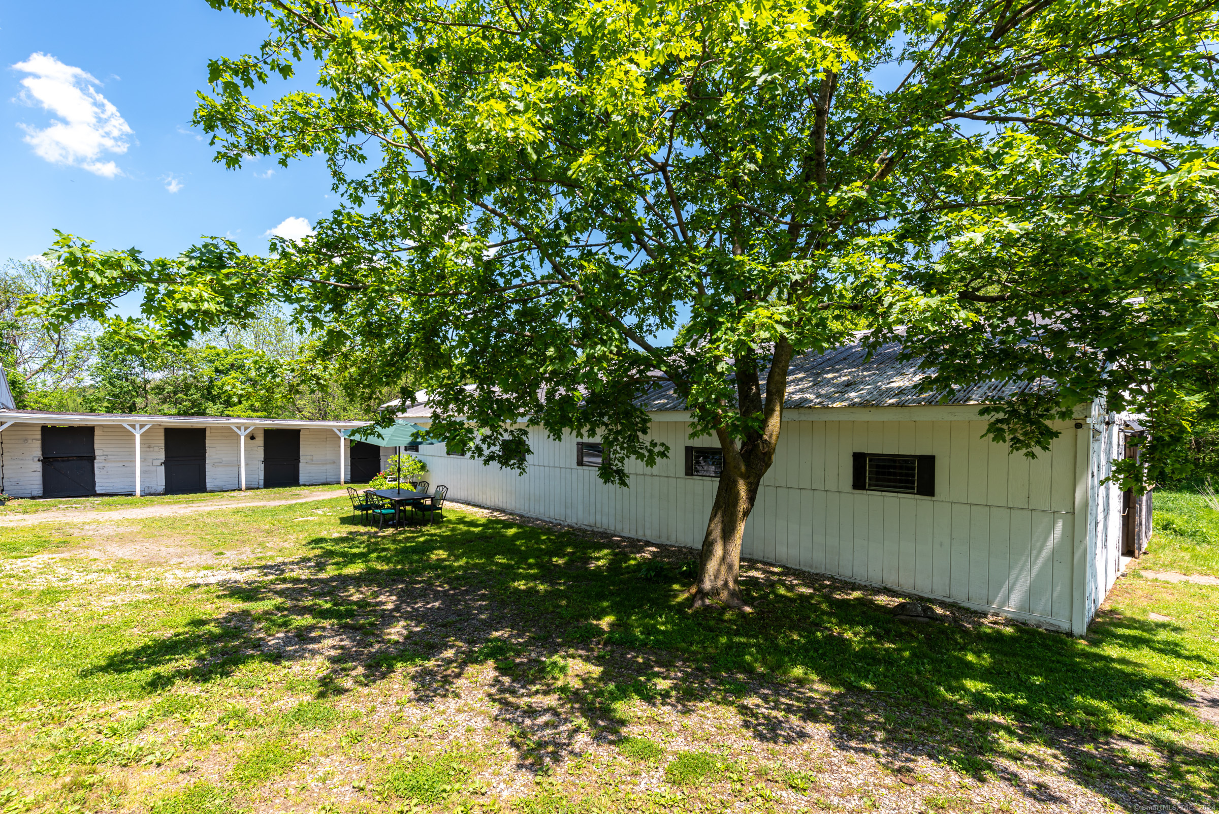 402 Perrin Road Woodstock, CT 06281 - Photo 3 of 40 a house with a yard