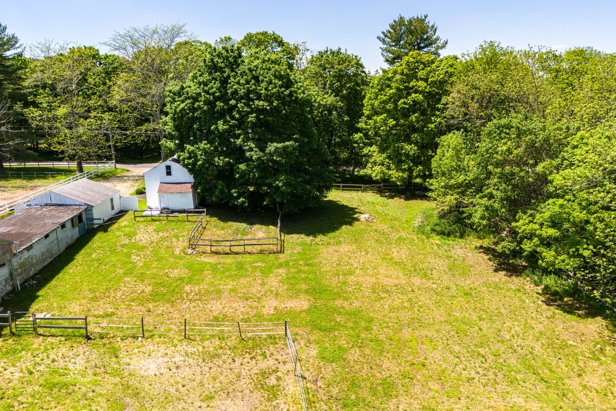 402 Perrin Road Woodstock, CT 06281 - Photo 36 of 40 a swimming pool with some trees in the background