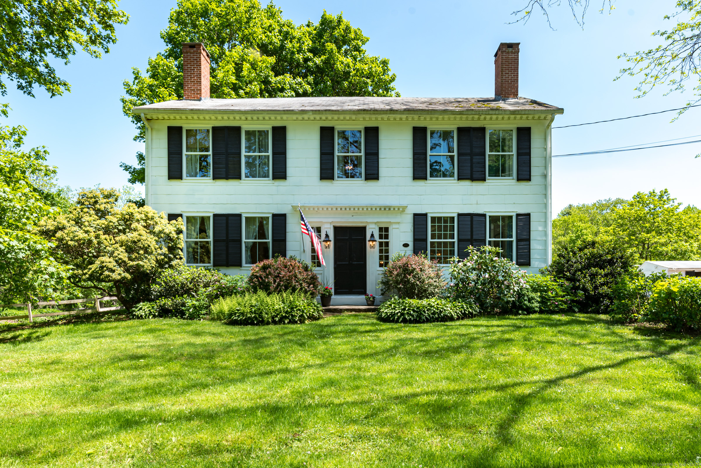 402 Perrin Road Woodstock, CT 06281 - Photo 40 of 40 a front view of a house with garden