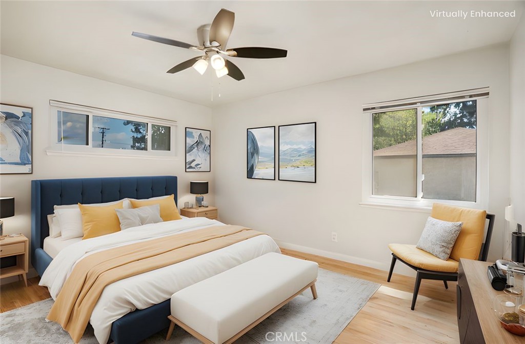 19738 Gresham Street Northridge, CA 91324 - Photo 13 of 35 a bedroom with a bed and a chair