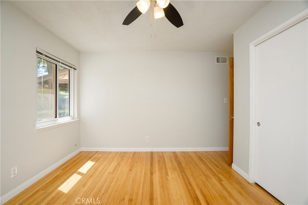 19738 Gresham Street Northridge, CA 91324 - Photo 14 of 35 wooden floor in an empty room with a window