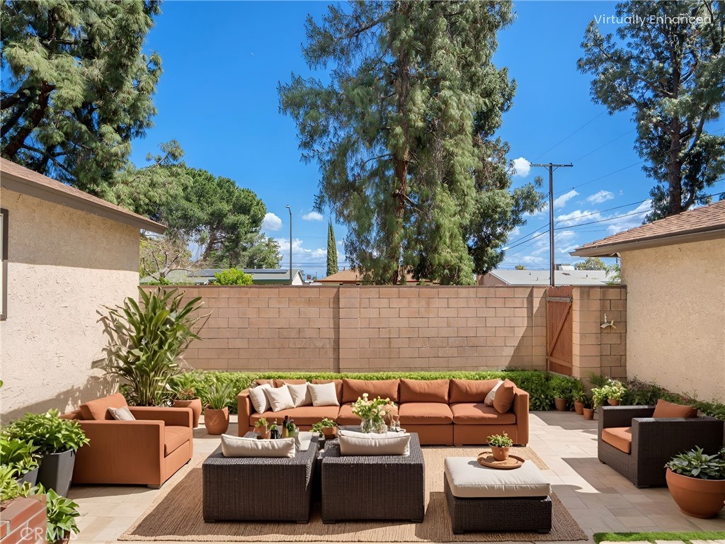 19738 Gresham Street Northridge, CA 91324 - Photo 19 of 35 a view of a patio with couches and potted plants
