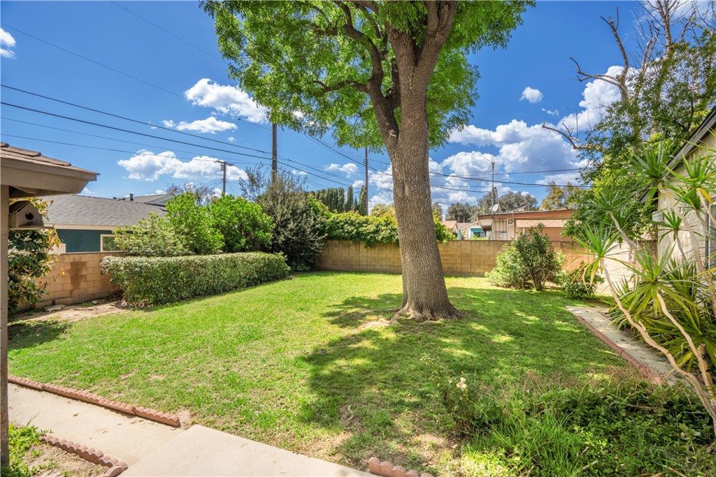 19738 Gresham Street Northridge, CA 91324 - Photo 21 of 35 a backyard of a house with lots of green space