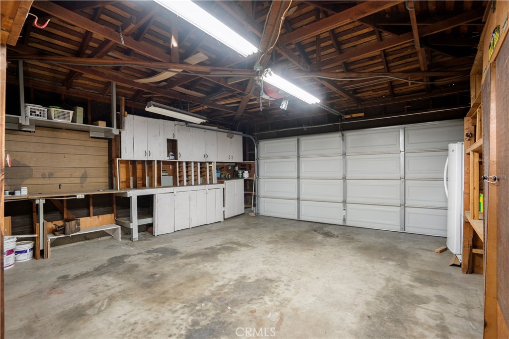 19738 Gresham Street Northridge, CA 91324 - Photo 23 of 35 a view of a garage room with stairs