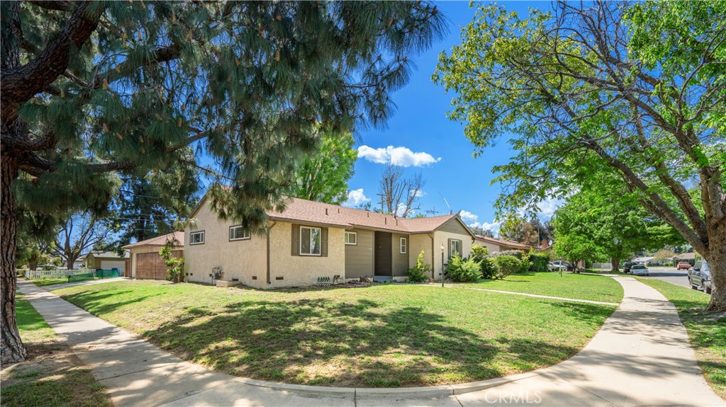 19738 Gresham Street Northridge, CA 91324 - Photo 28 of 35 a front view of a house with a yard