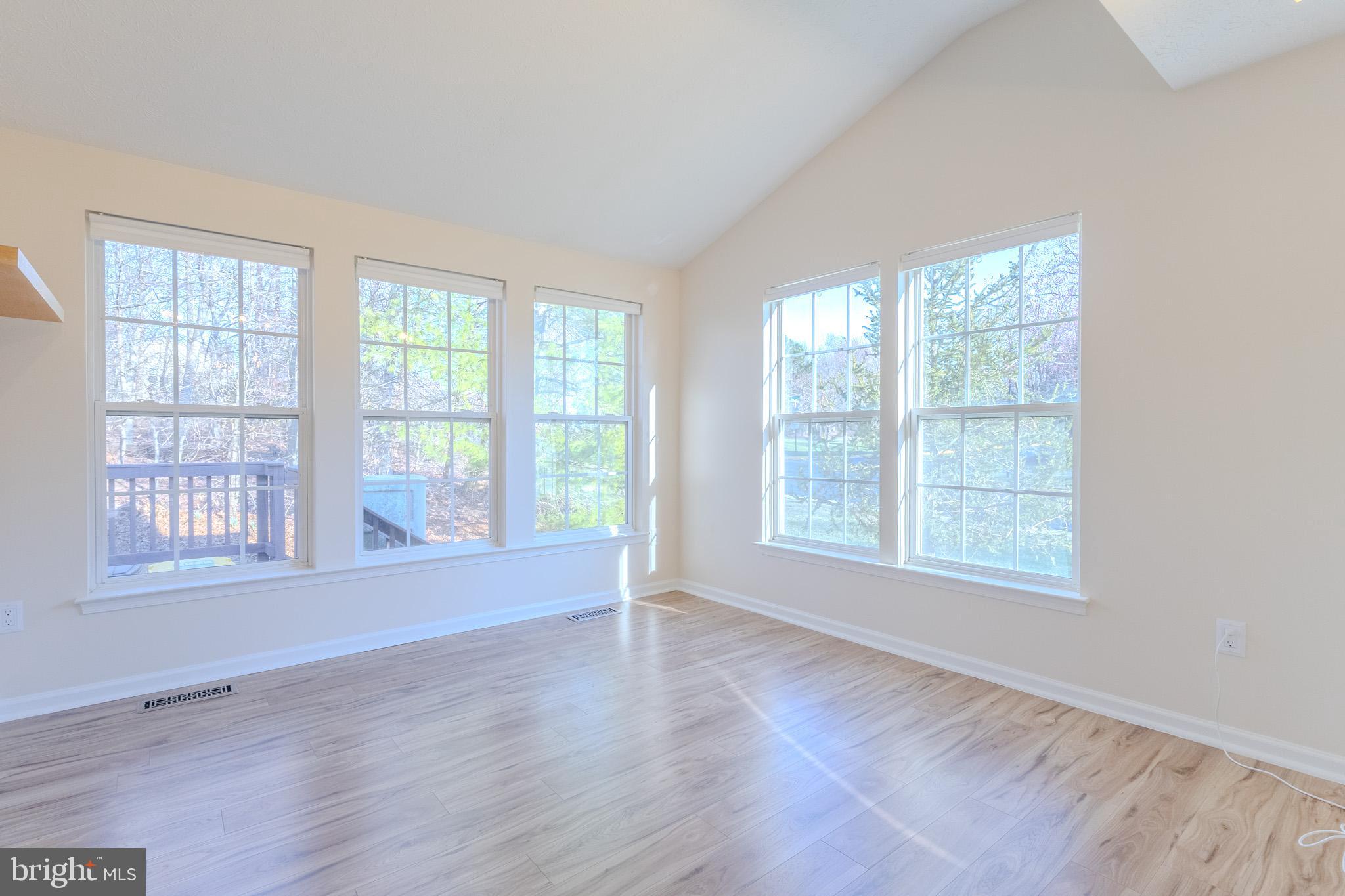 2437 High Brandy Way Odenton, MD 21113 - Photo 15 of 47 an empty room with wooden floor and windows