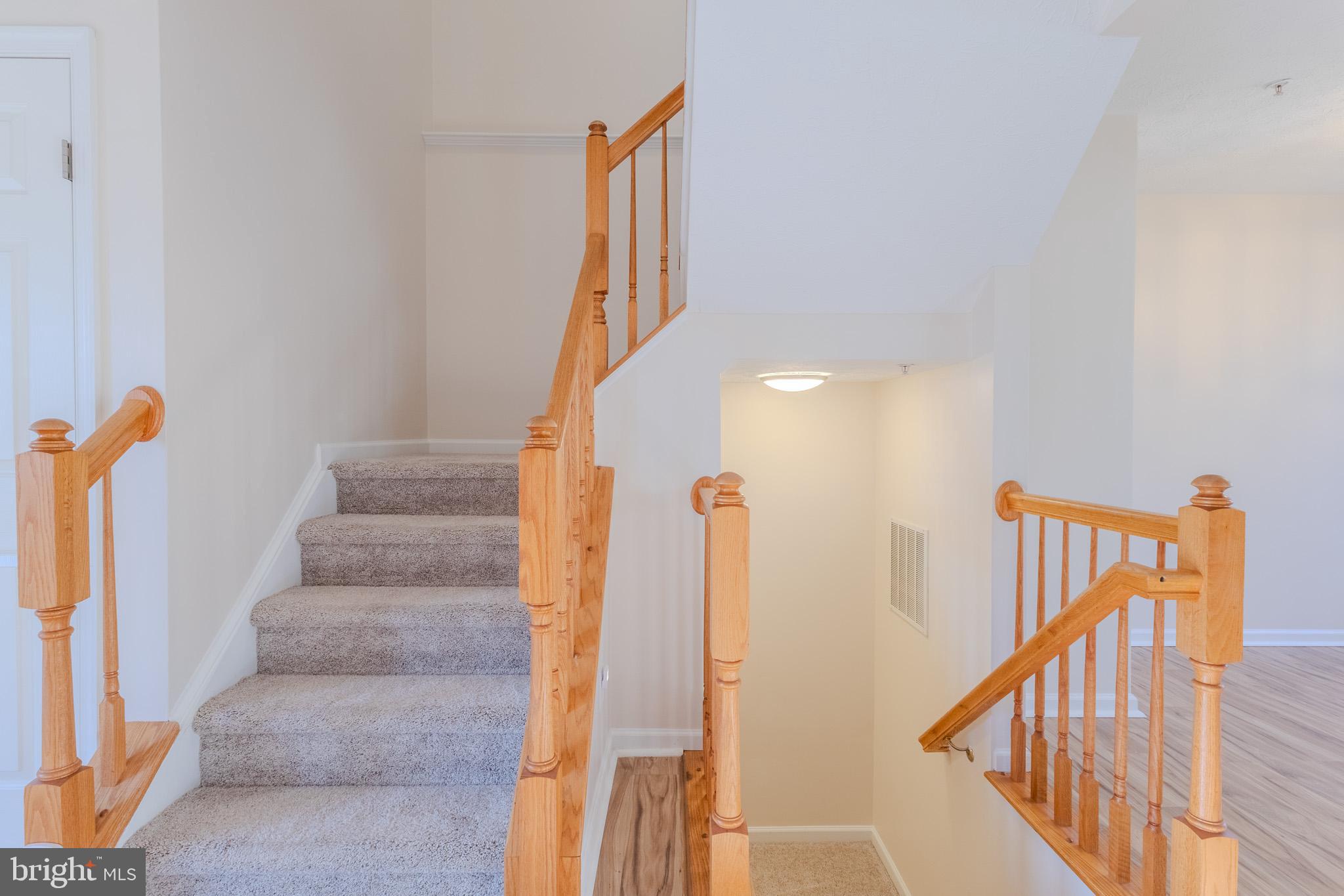 2437 High Brandy Way Odenton, MD 21113 - Photo 18 of 47 a view of staircase with railing and white walls