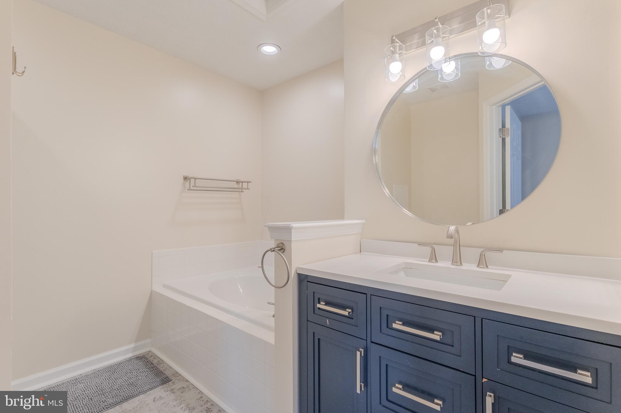 2437 High Brandy Way Odenton, MD 21113 - Photo 29 of 47 a bathroom with a sink and a mirror