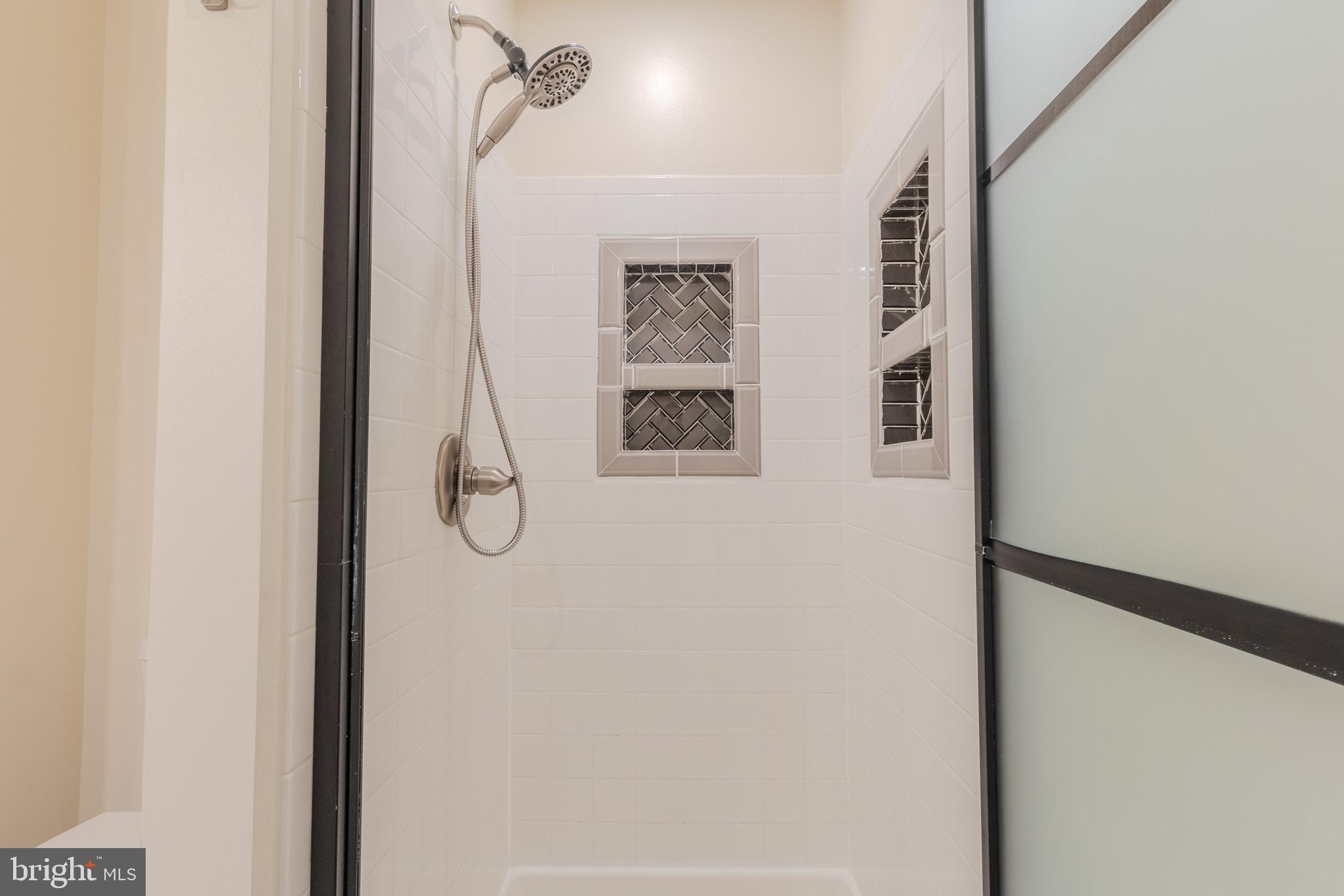 2437 High Brandy Way Odenton, MD 21113 - Photo 31 of 47 a bathroom with a glass shower door