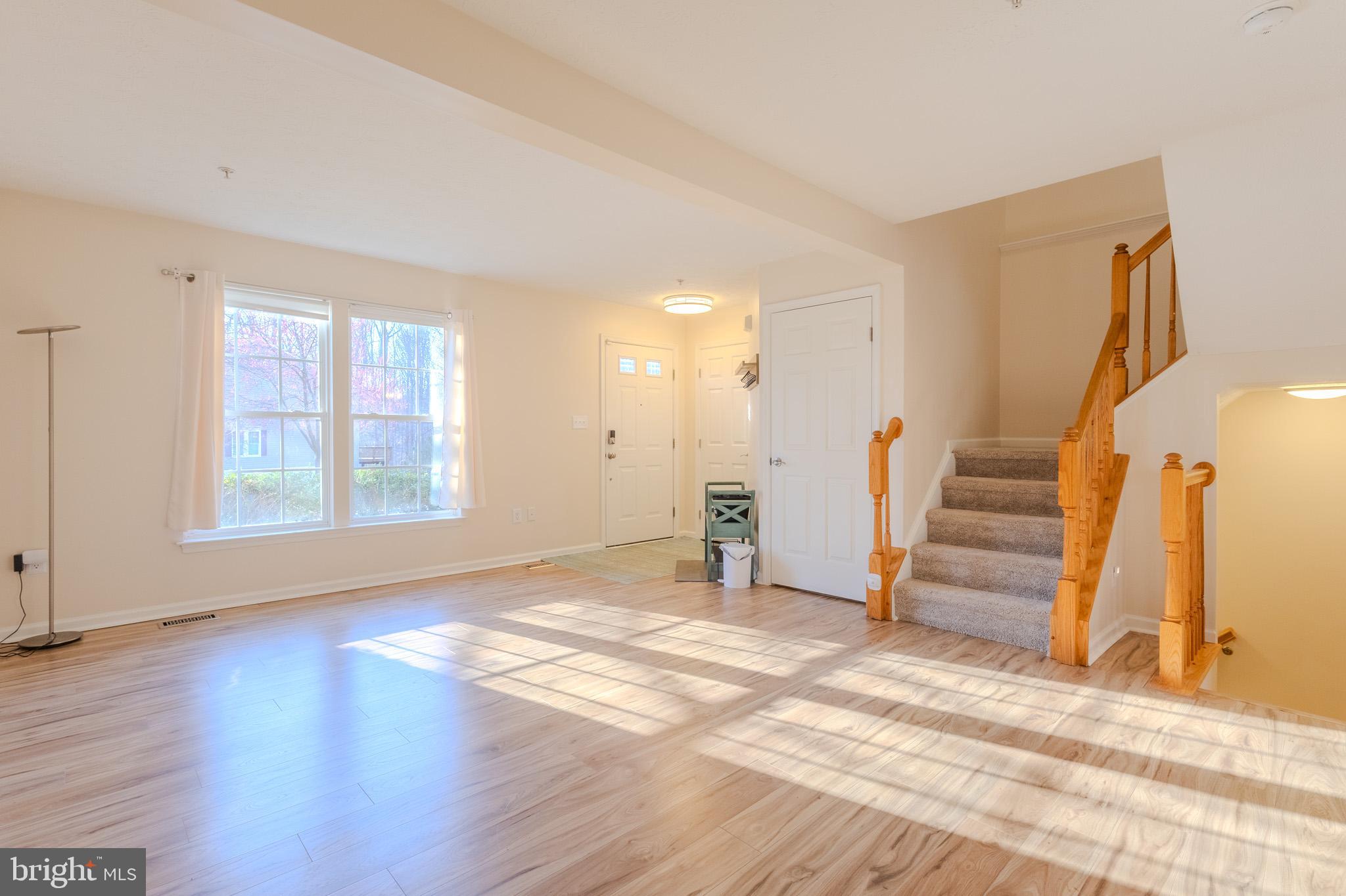 2437 High Brandy Way Odenton, MD 21113 - Photo 7 of 47 a view of empty room with wooden floor and window