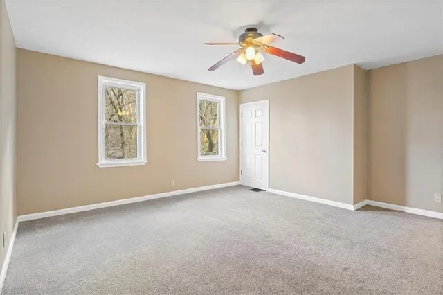 a bathroom with a shower toilet and sink