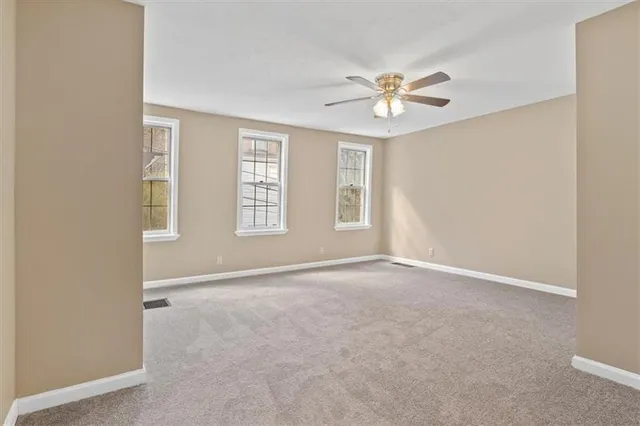 a bathroom with a sink toilet vanity and tub