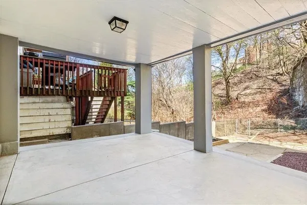a view of a porch with a floor to ceiling window