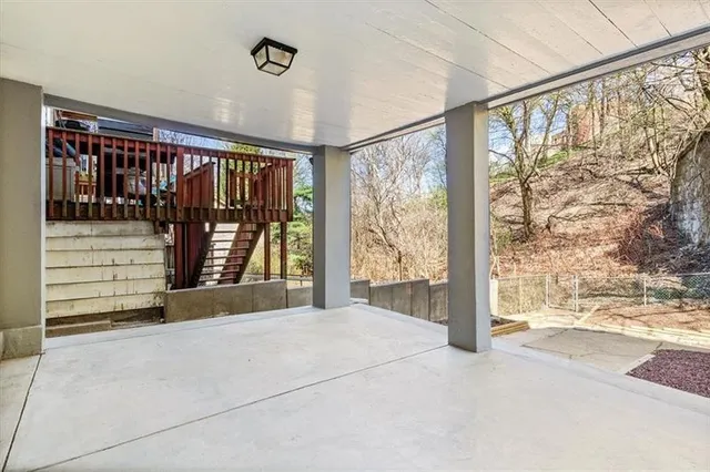 a view of a porch with a floor to ceiling window