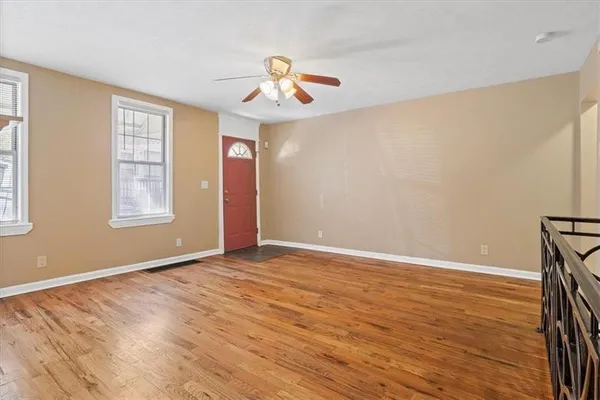 a kitchen with white cabinets and appliances
