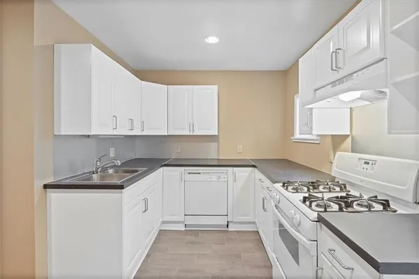 a kitchen with a stove and a refrigerator