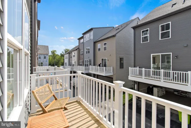 a view of a house with wooden deck
