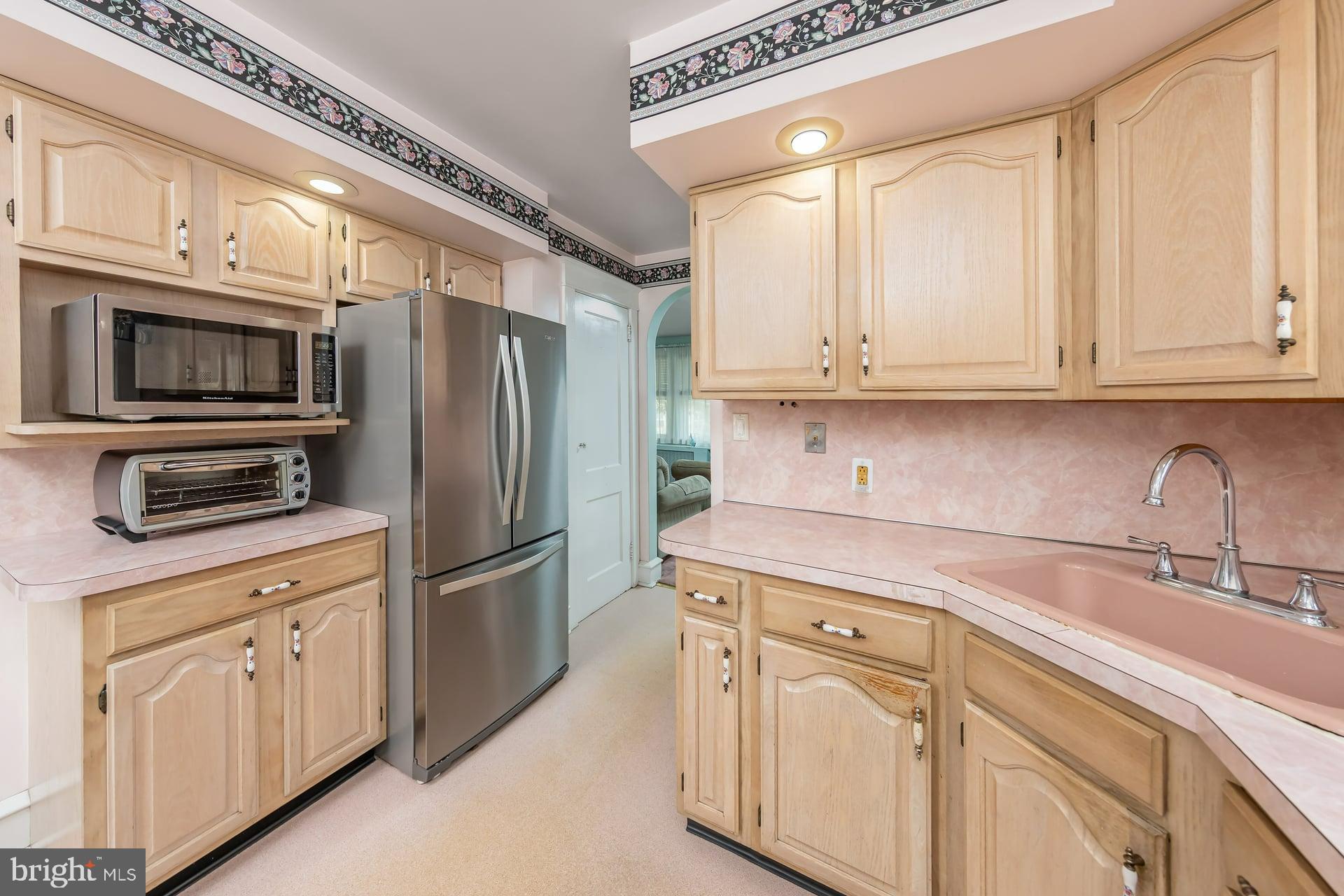132 Tomlin Road Gibbstown, NJ 08027 - Photo 12 of 18 a kitchen with stainless steel appliances granite countertop a refrigerator sink and cabinets