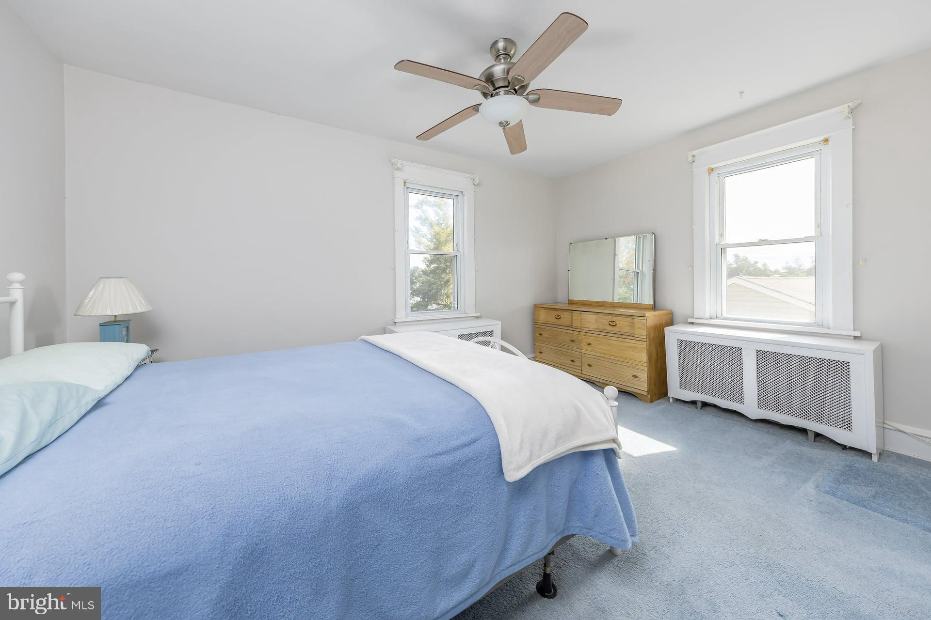 132 Tomlin Road Gibbstown, NJ 08027 - Photo 13 of 18 a spacious bedroom with a bed and a window