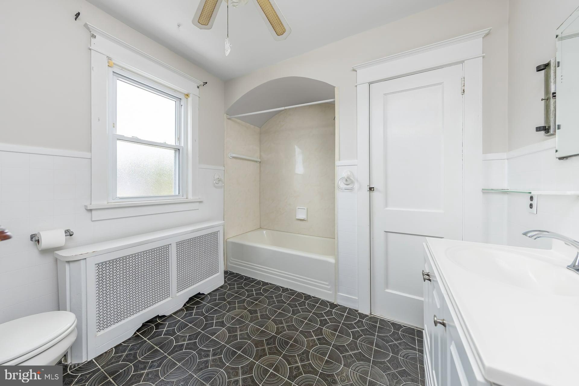 132 Tomlin Road Gibbstown, NJ 08027 - Photo 15 of 18 a bathroom with a sink a toilet and bathtub