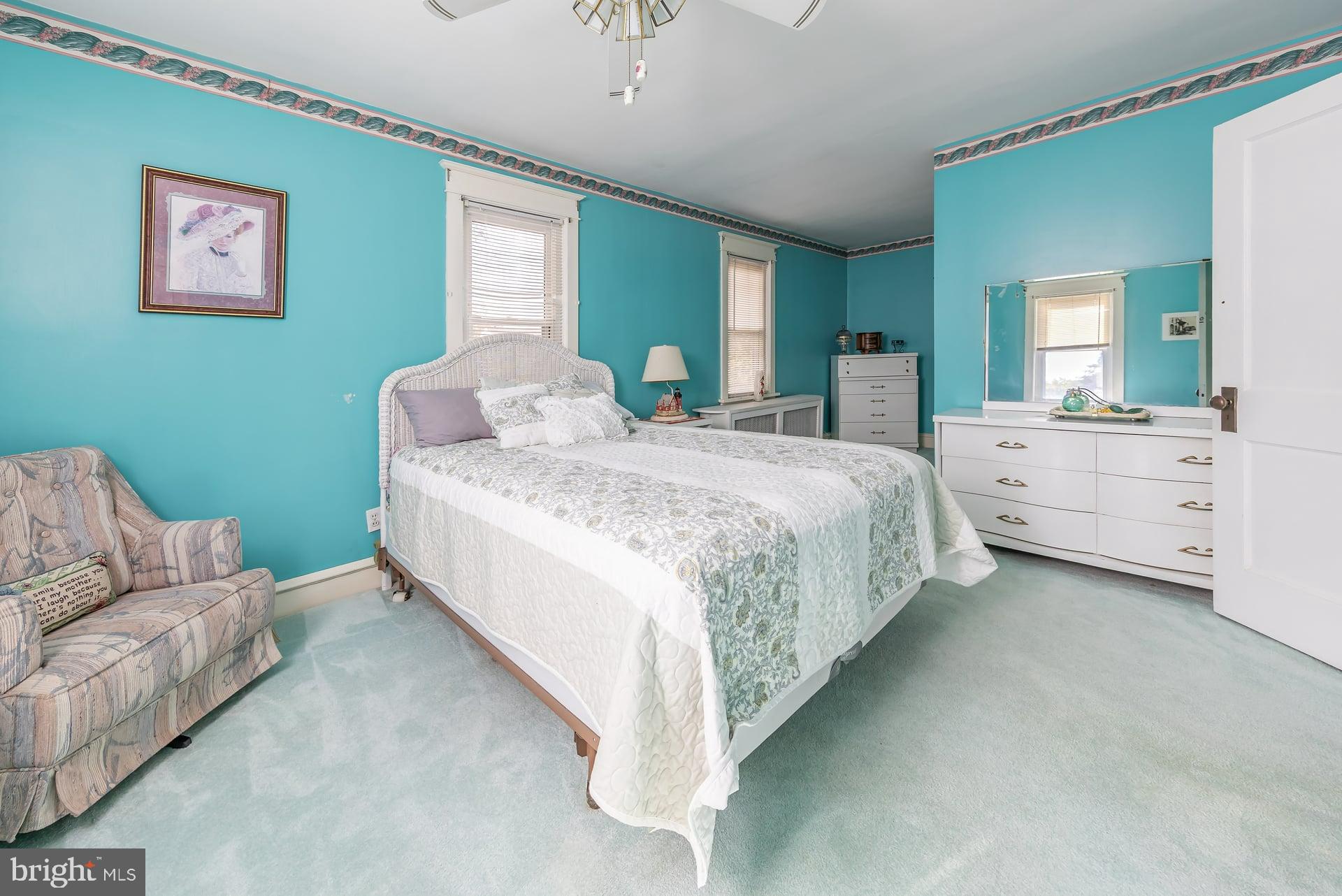 132 Tomlin Road Gibbstown, NJ 08027 - Photo 16 of 18 a spacious bedroom with a bed and a couch