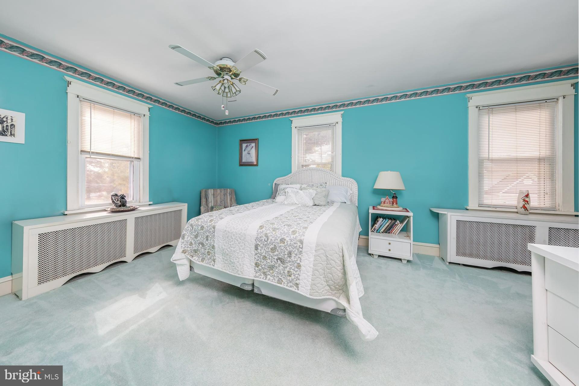 132 Tomlin Road Gibbstown, NJ 08027 - Photo 17 of 18 a bedroom with a bed and a large window