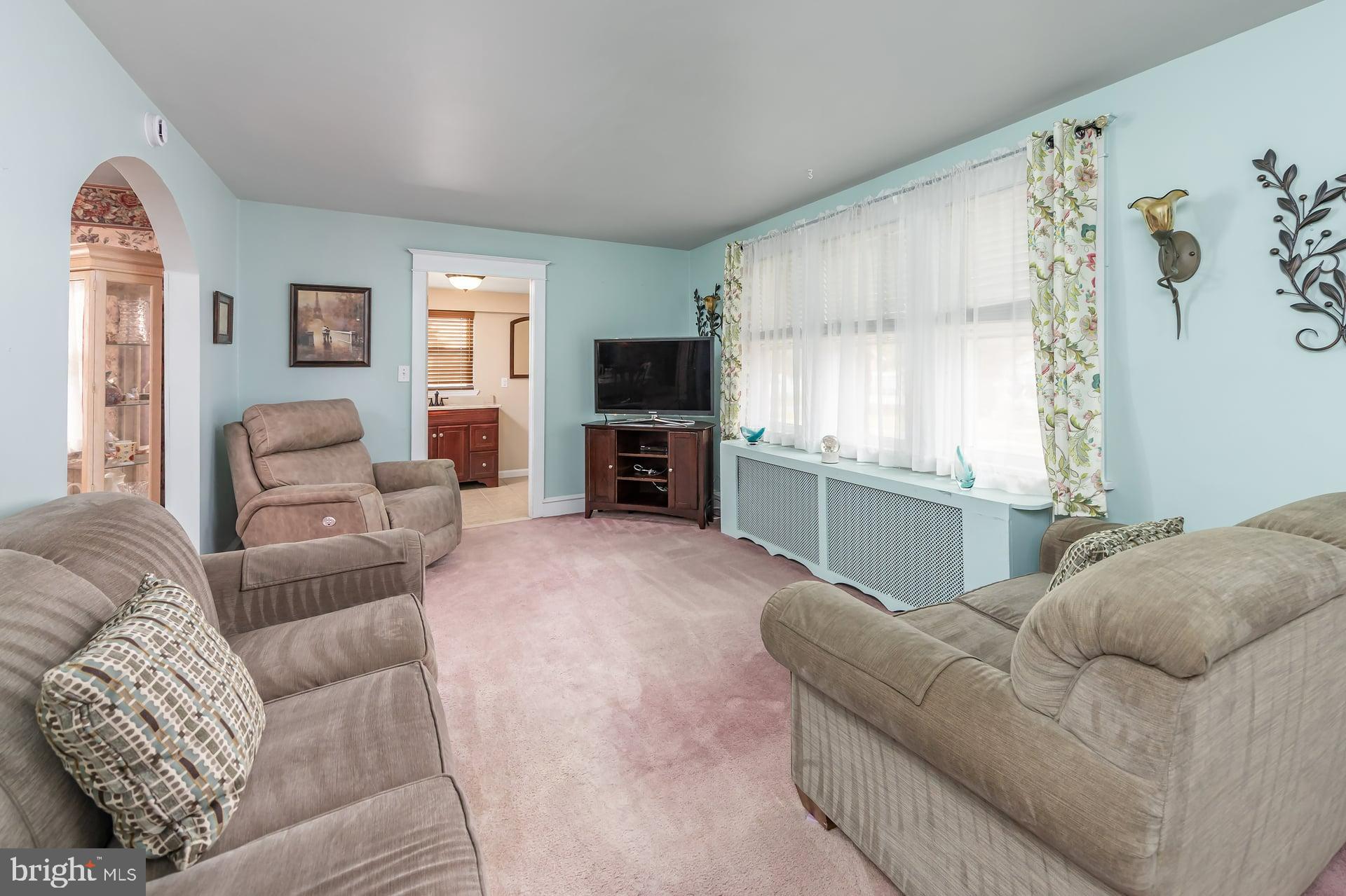 132 Tomlin Road Gibbstown, NJ 08027 - Photo 4 of 18 a living room with furniture and a flat screen tv