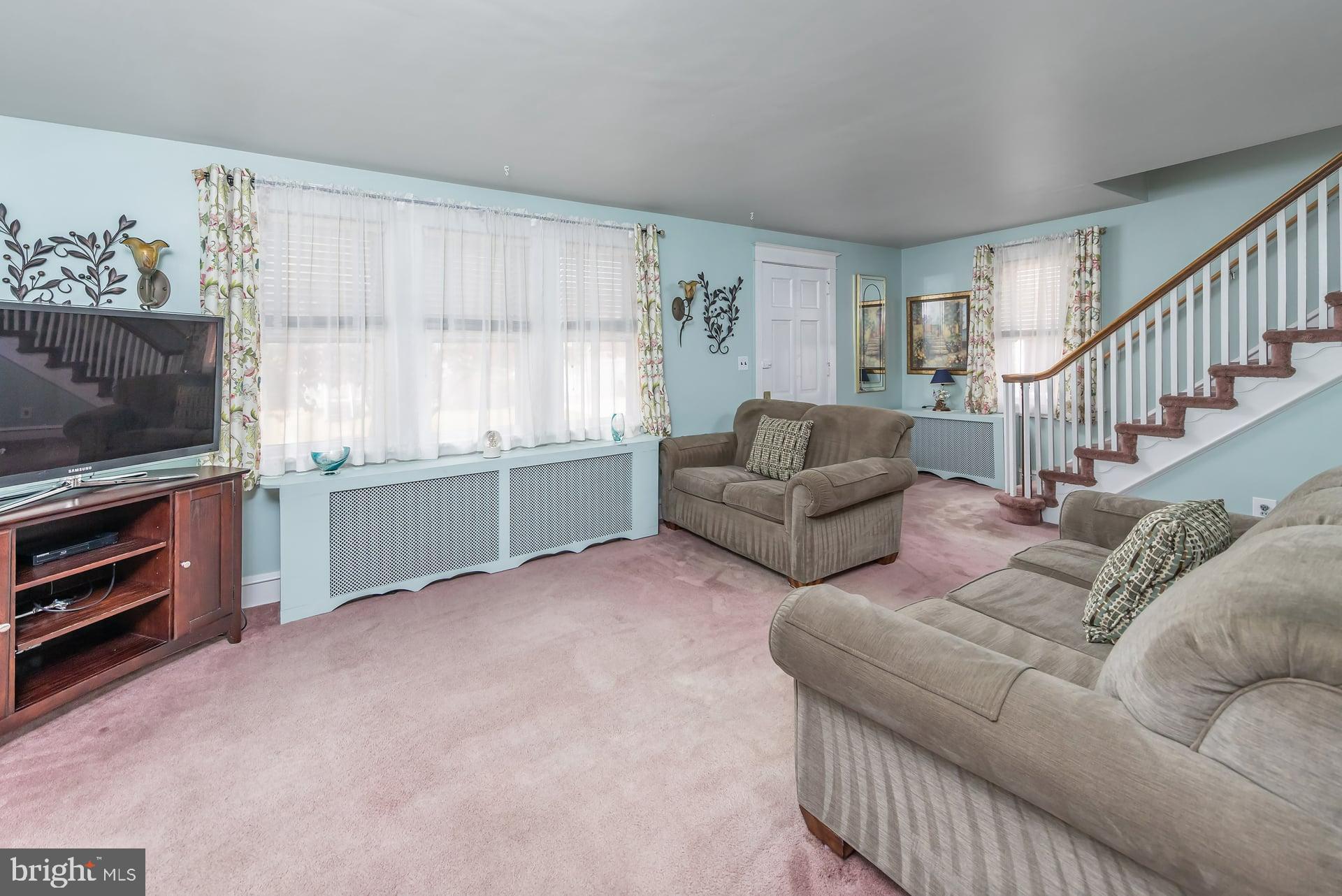 132 Tomlin Road Gibbstown, NJ 08027 - Photo 5 of 18 a living room with furniture and a flat screen tv