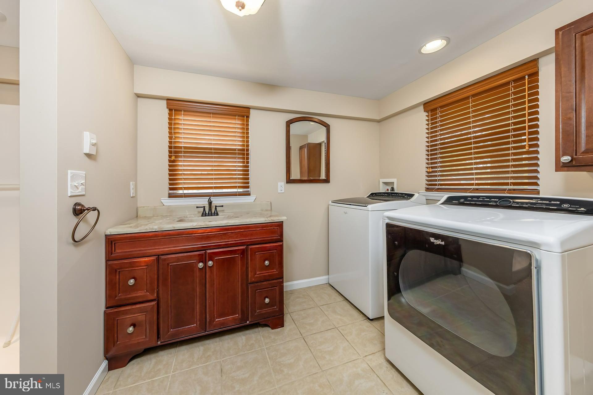 132 Tomlin Road Gibbstown, NJ 08027 - Photo 9 of 18 a room with cabinets and window