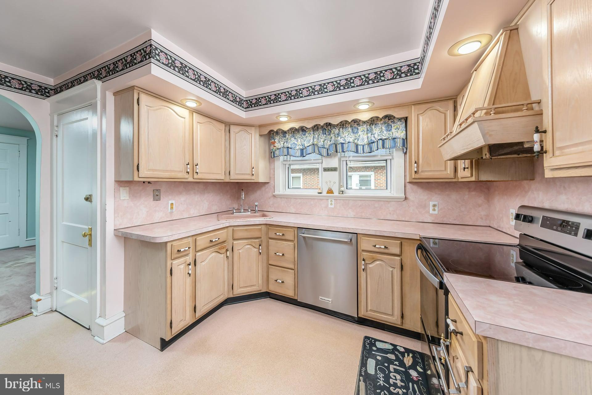 132 Tomlin Road Gibbstown, NJ 08027 - Photo 10 of 18 a kitchen with stainless steel appliances granite countertop a sink a stove and a refrigerator
