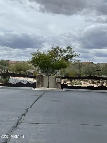 a view of a city street and car parked