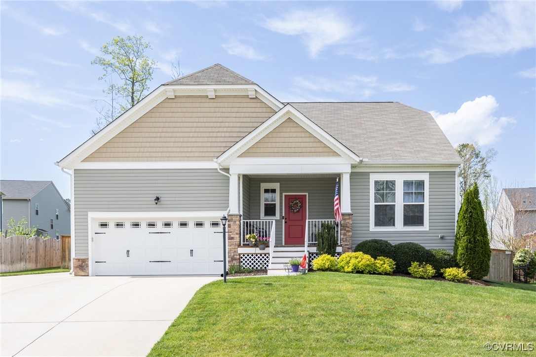 a view of a house with a yard and plants