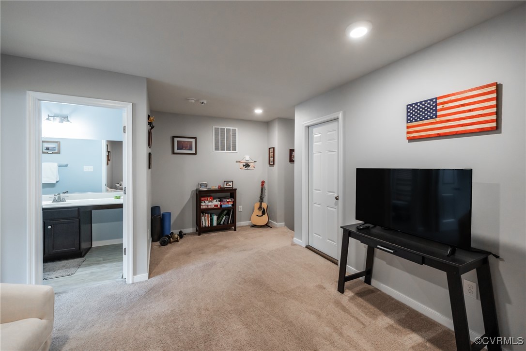 4143 Cambrian Circle Midlothian, VA 23112 - Photo 28 of 37 a living room with furniture and a flat screen tv