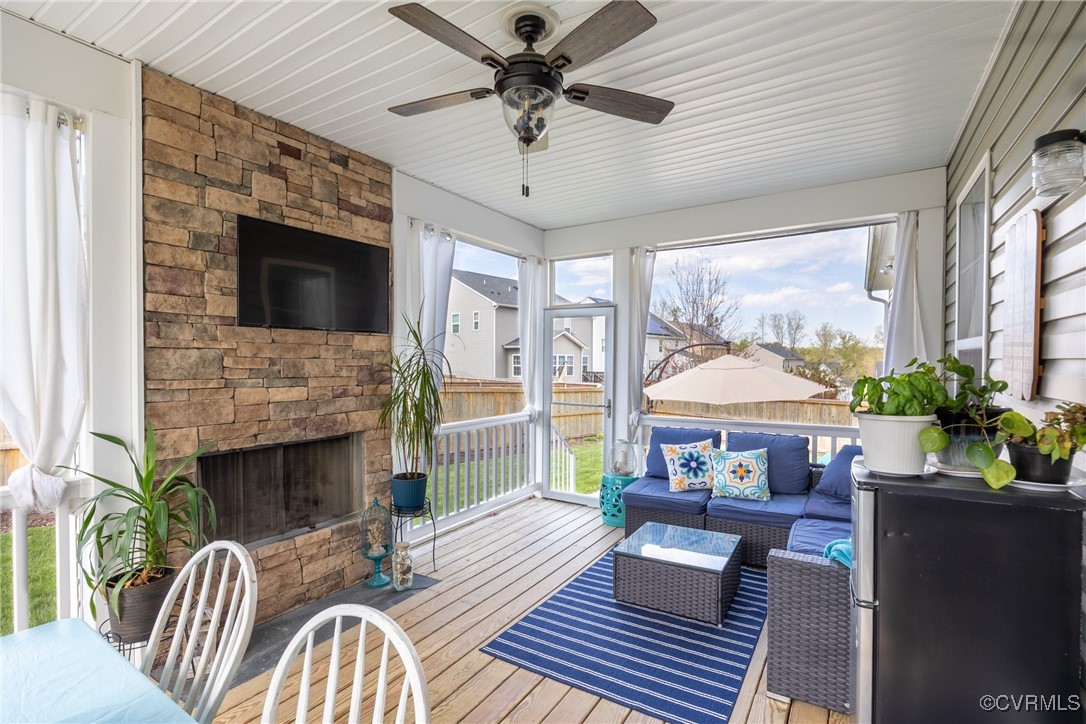 4143 Cambrian Circle Midlothian, VA 23112 - Photo 33 of 37 a living room with furniture a flat screen tv and a fireplace