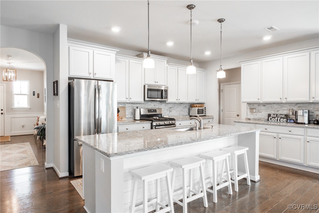 4143 Cambrian Circle Midlothian, VA 23112 - Photo 5 of 37 a kitchen with stainless steel appliances granite countertop a refrigerator a stove a sink a center island a dining table and chairs