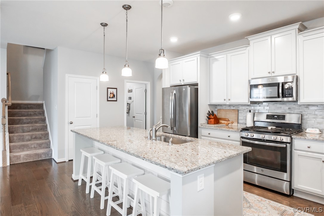 4143 Cambrian Circle Midlothian, VA 23112 - Photo 7 of 37 a kitchen with stainless steel appliances a stove a sink and a refrigerator