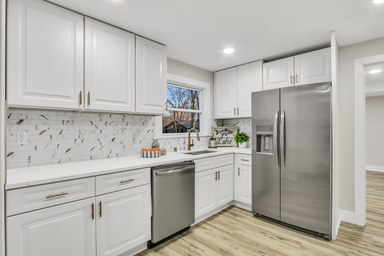 38323 North 3rd Avenue Spring Grove, IL 60081 - Photo 11 of 27 a kitchen with a sink a refrigerator and cabinets