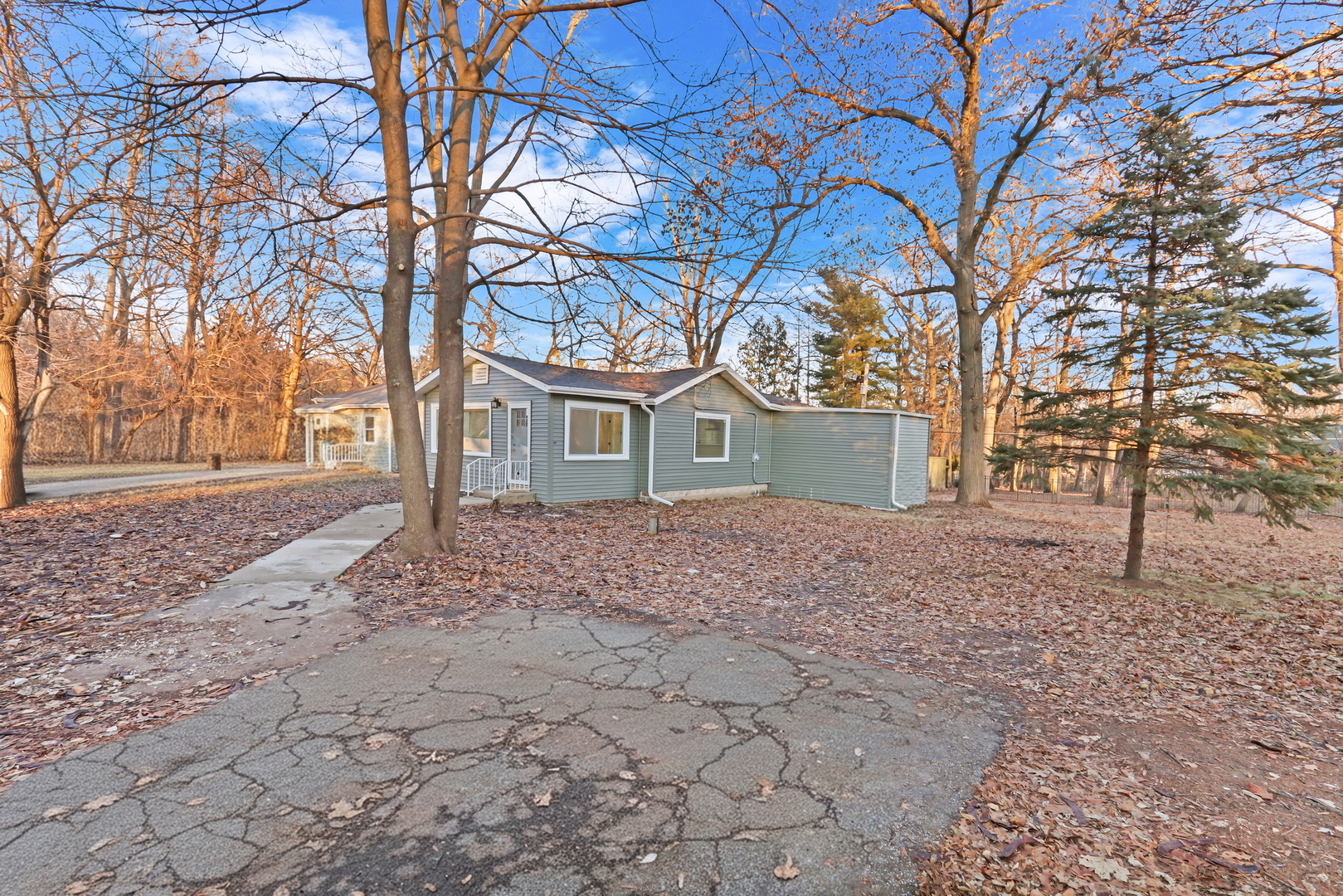 38323 North 3rd Avenue Spring Grove, IL 60081 - Photo 22 of 27 a front view of a house with a yard and trees