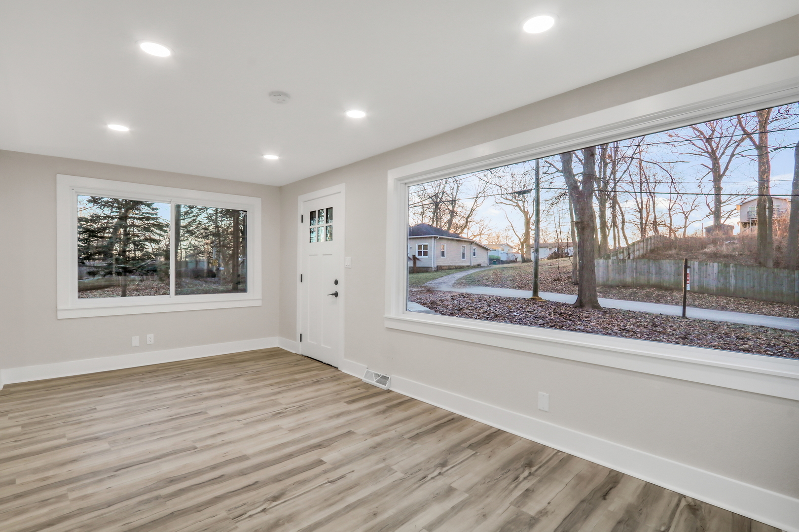 38323 North 3rd Avenue Spring Grove, IL 60081 - Photo 5 of 27 a view of an empty room with wooden floor and a window