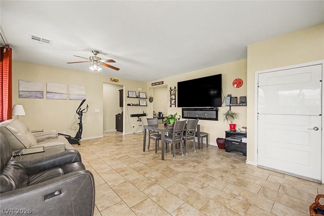 4914 East Beacon Ridge Drive Pahrump, NV 89061 - Photo 11 of 34 A versatile living space with light-colored tile flooring awaits your personal touch.