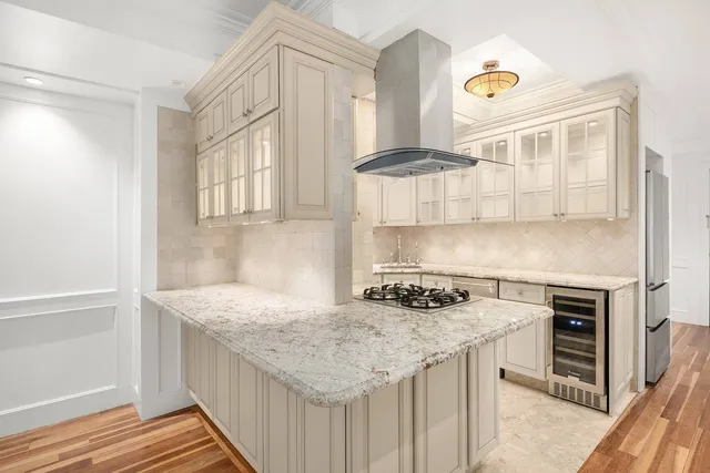 a kitchen with granite countertop a stove and a sink